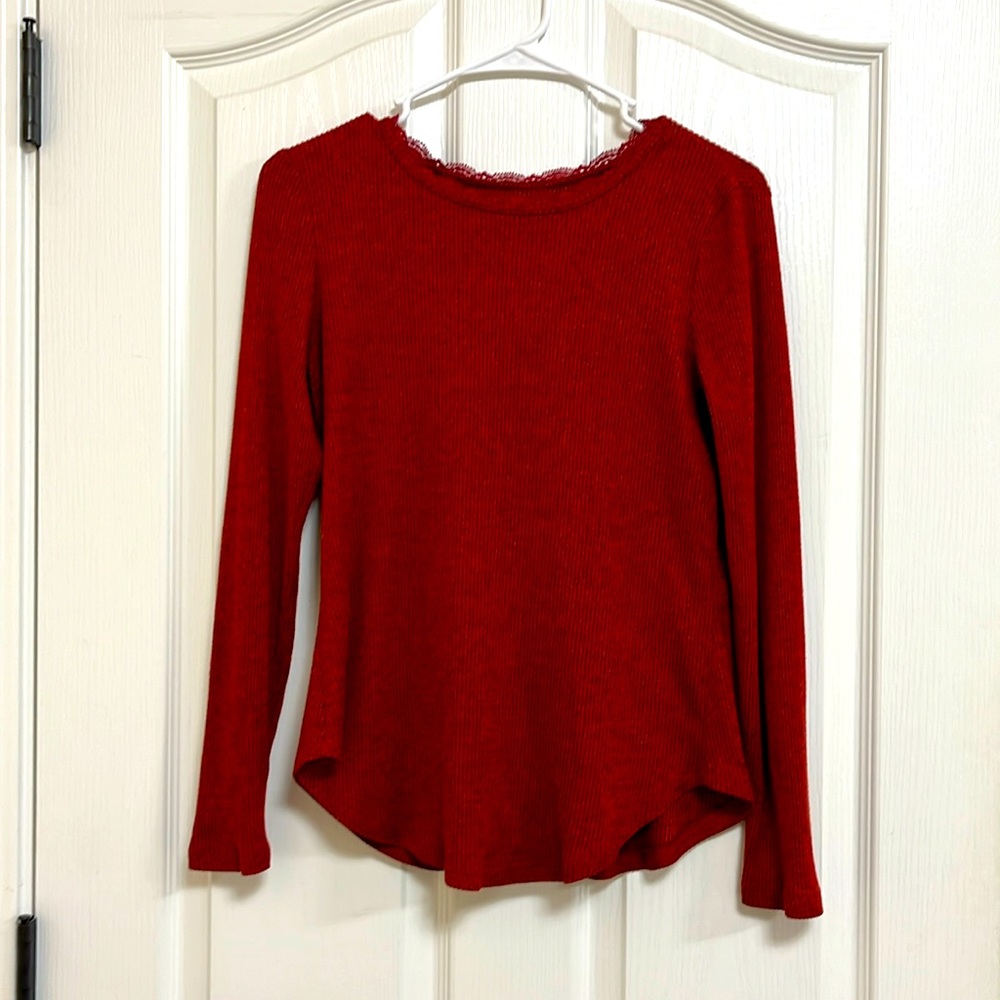 I’m selling a red long sleeve with lease at the top.